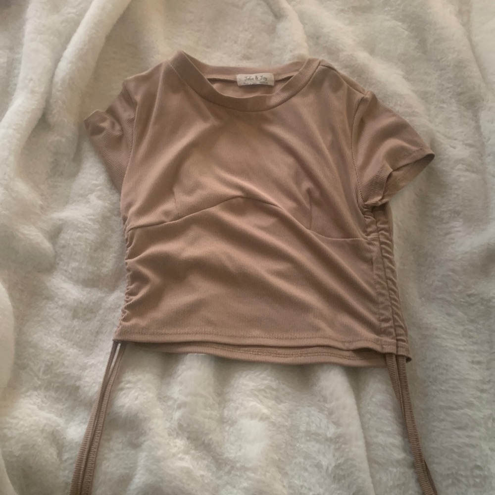 size-M, nice soft material and adjustable strings on the side.